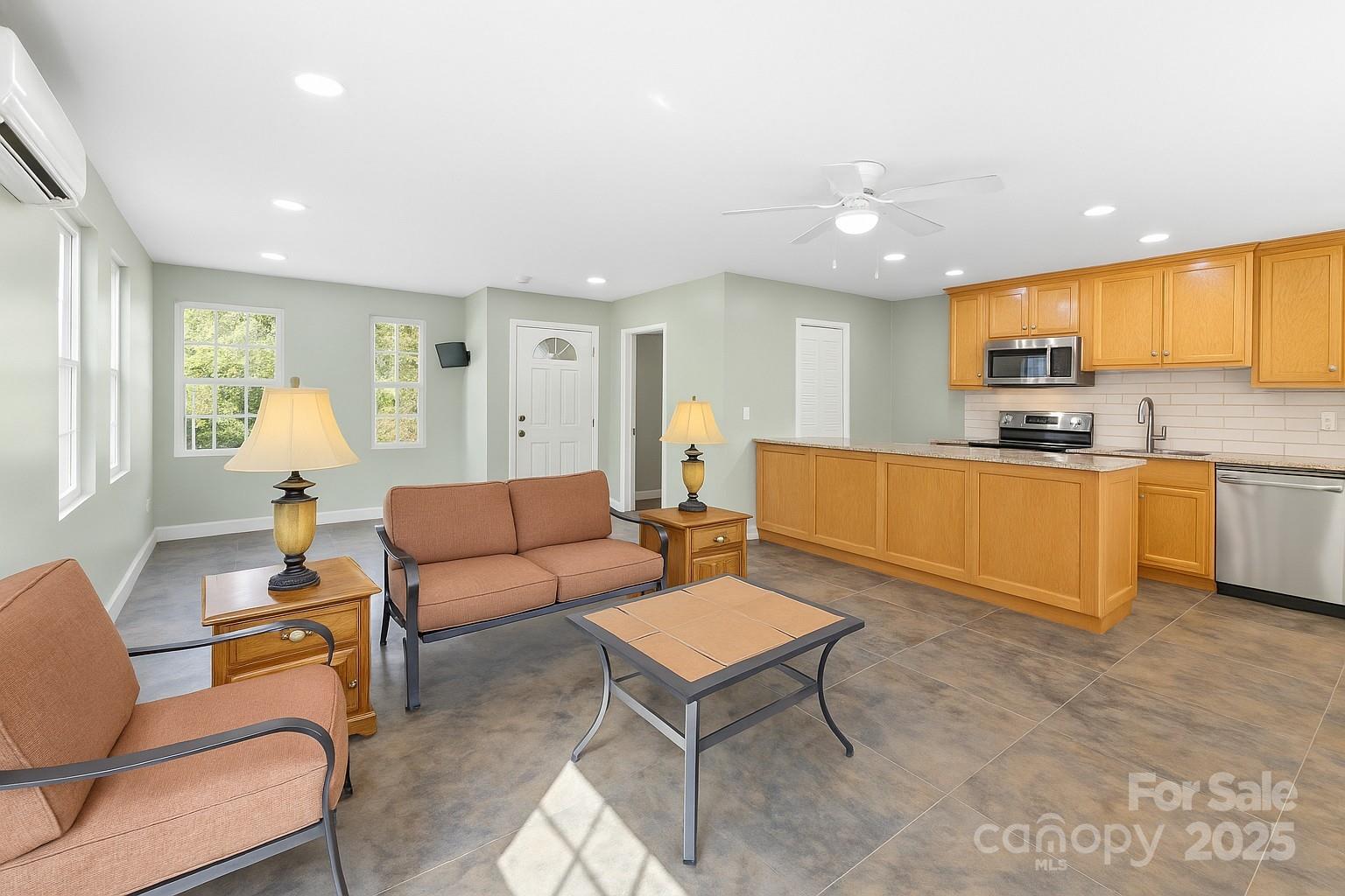 2411 Mission Road York, SC 29745 - Photo 20 of 30 a living room with stainless steel appliances kitchen island granite countertop furniture and a refrigerator