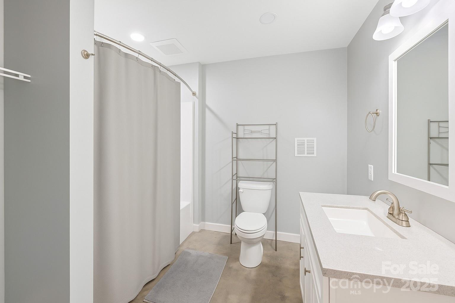 2411 Mission Road York, SC 29745 - Photo 22 of 30 a bathroom with a sink toilet and shower