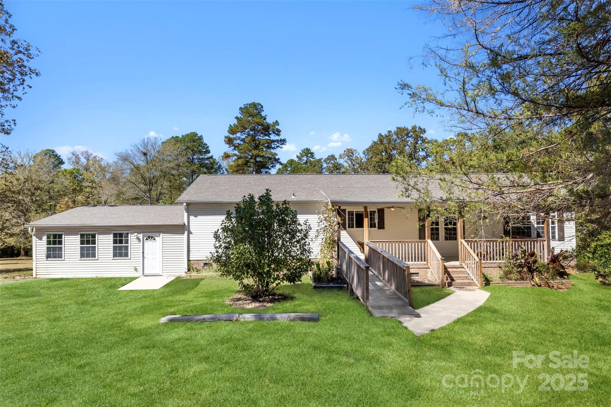 2411 Mission Road York, SC 29745 - Photo 23 of 30 a view of a house with a backyard porch and sitting area