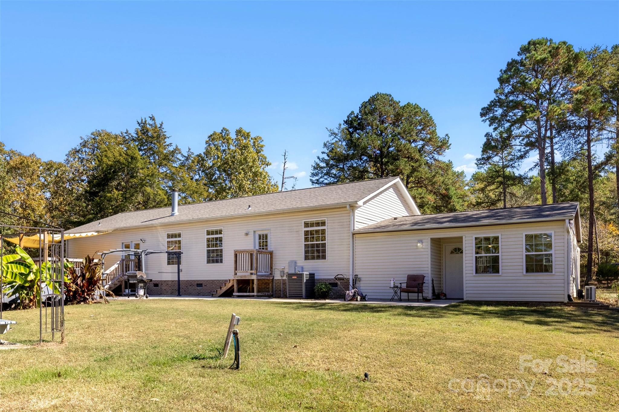 2411 Mission Road York, SC 29745 - Photo 26 of 30 a view of a yard with a house and a swimming pool
