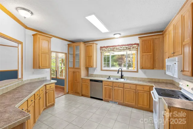 a large kitchen with a large window and a sink