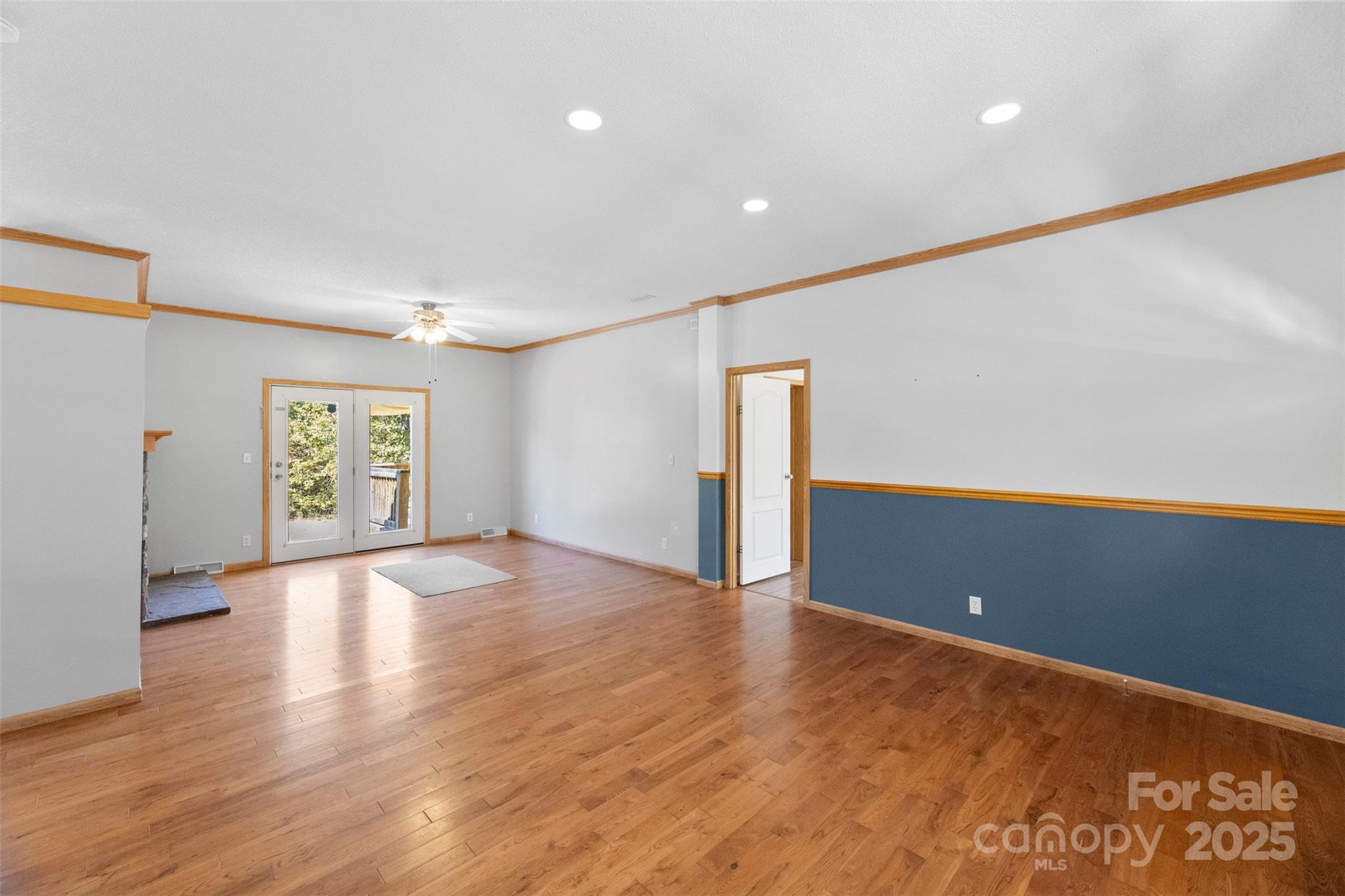 2411 Mission Road York, SC 29745 - Photo 6 of 30 a view of an empty room with wooden floor and a window