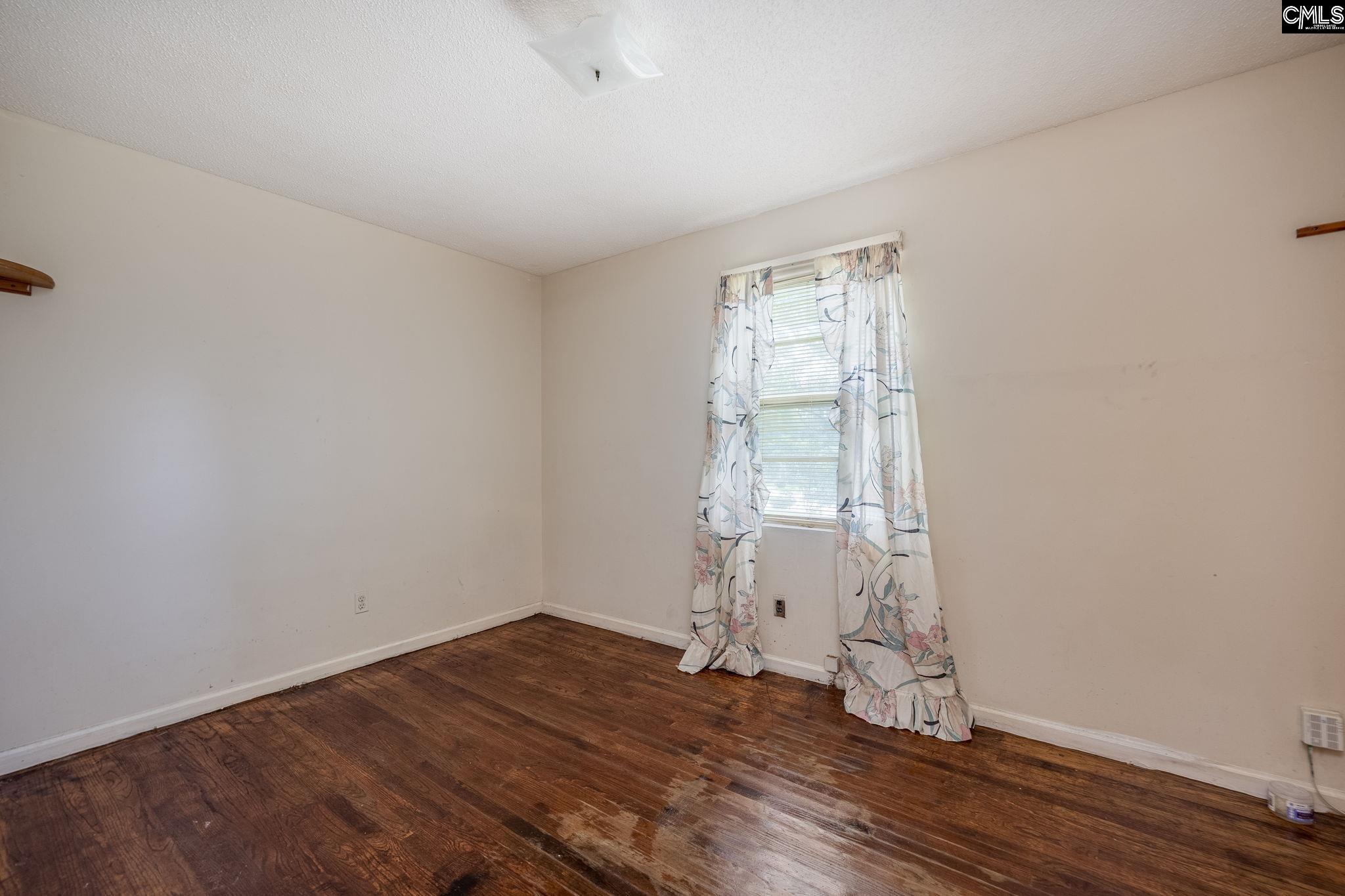 5666 Middleton Court Columbia, SC 29203 - Photo 34 of 42 an empty room with wooden floor and windows