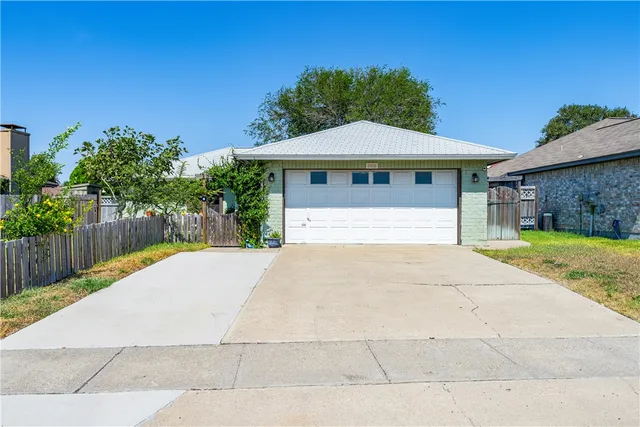 a front view of a house with yard