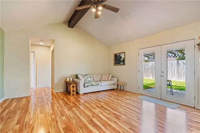 a bedroom with furniture and a wooden floor