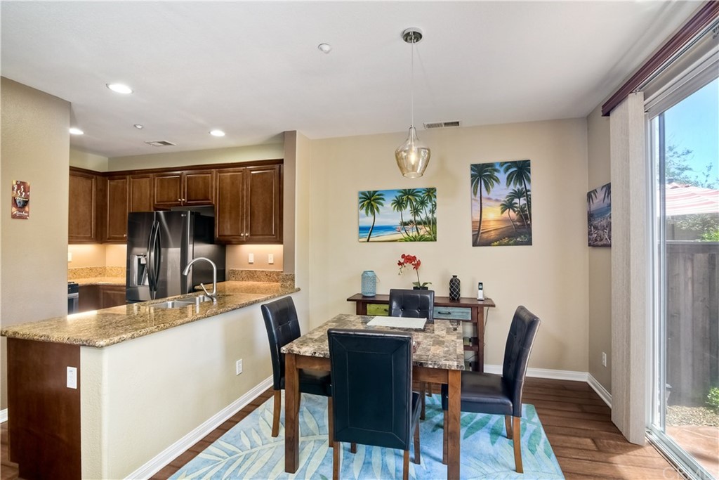 4115 Karst Road Carlsbad, CA 92010 - Photo 11 of 33 a view of a dining room with furniture