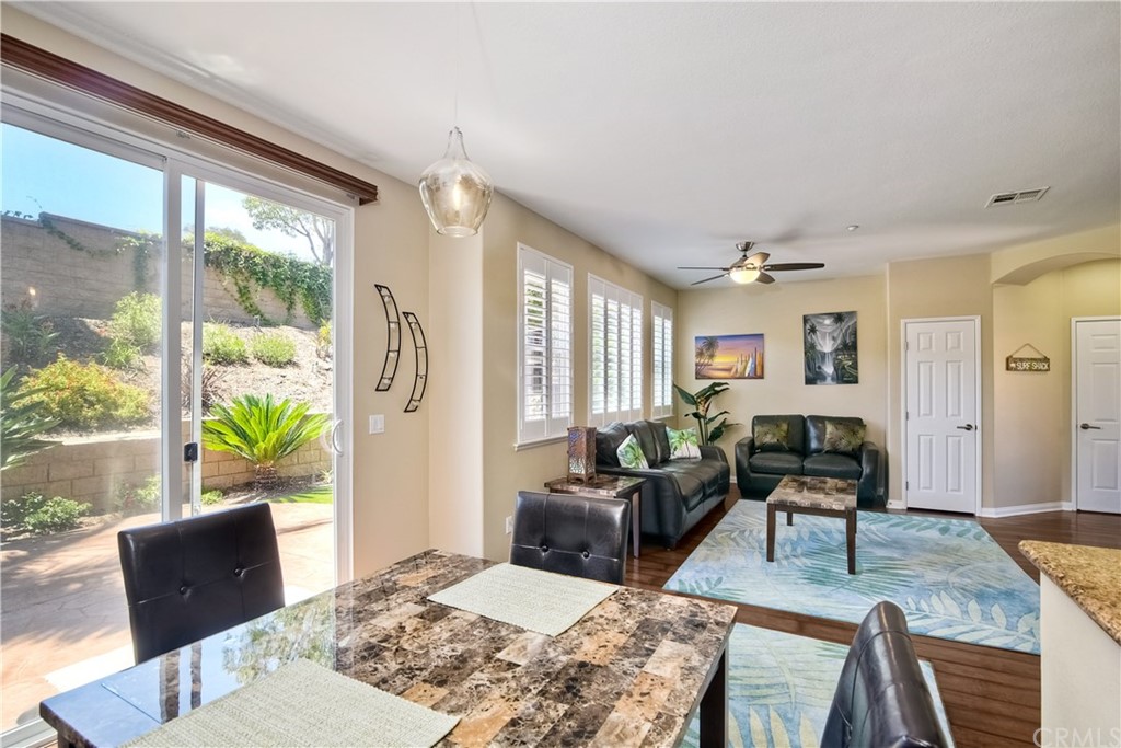 4115 Karst Road Carlsbad, CA 92010 - Photo 13 of 33 a living room with furniture wooden floor and a large window