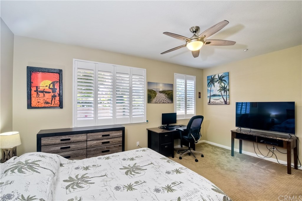 4115 Karst Road Carlsbad, CA 92010 - Photo 24 of 33 a bedroom with a bed and a flat screen tv