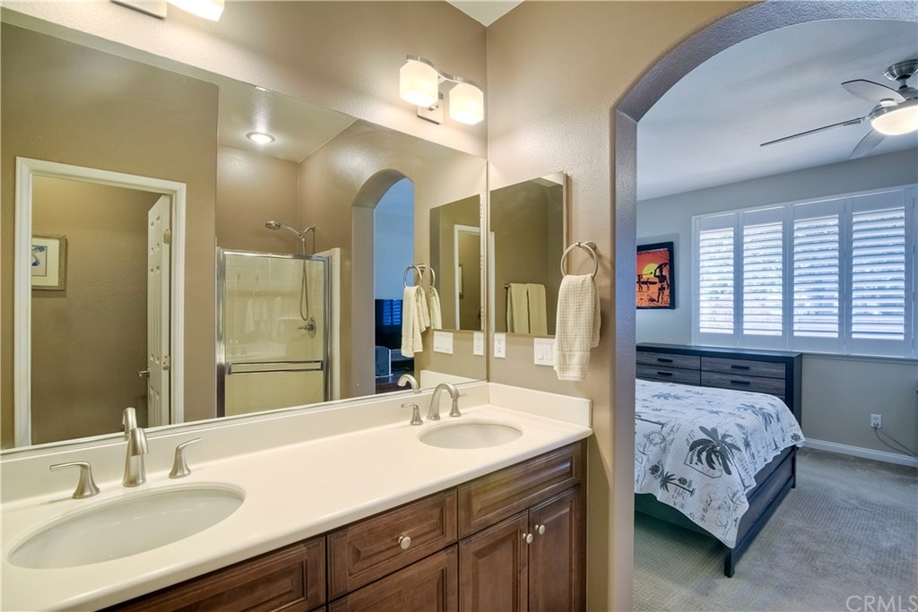 4115 Karst Road Carlsbad, CA 92010 - Photo 26 of 33 a en suite bathroom with double sink and a mirror