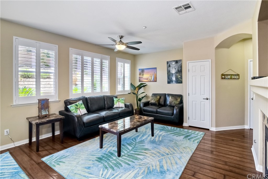 4115 Karst Road Carlsbad, CA 92010 - Photo 7 of 33 a living room with furniture and a wooden floor