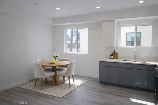 a view of a dining room with furniture and window