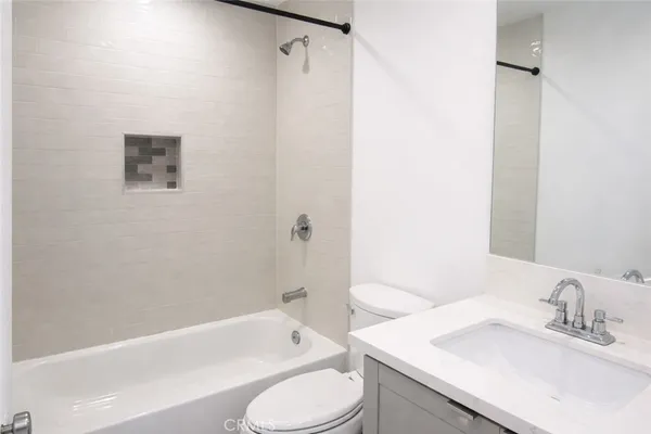 a bathroom with a sink toilet and bathtub
