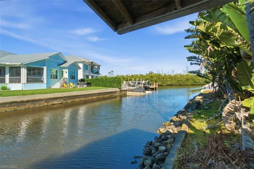 a view of residential houses with outdoor space and lake view