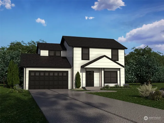 a front view of a house with a garden and garage