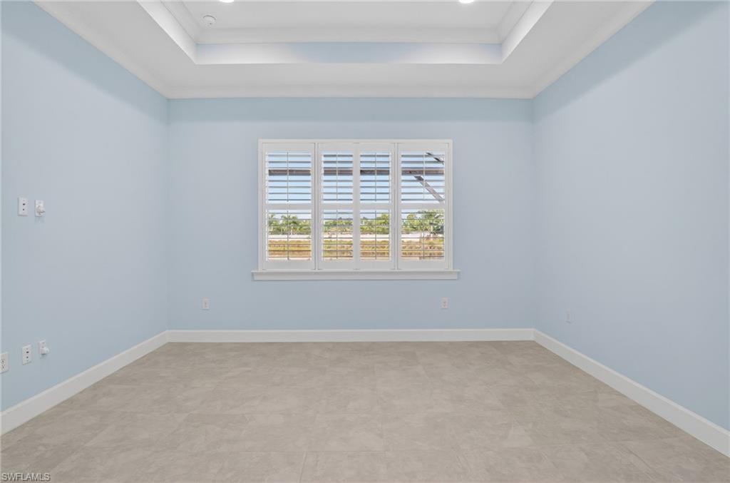 8813 Yucatan Court Naples, FL 34113 - Photo 21 of 43 Primary Bedroom featuring ornamental molding, a raised ceiling, and recessed lighting