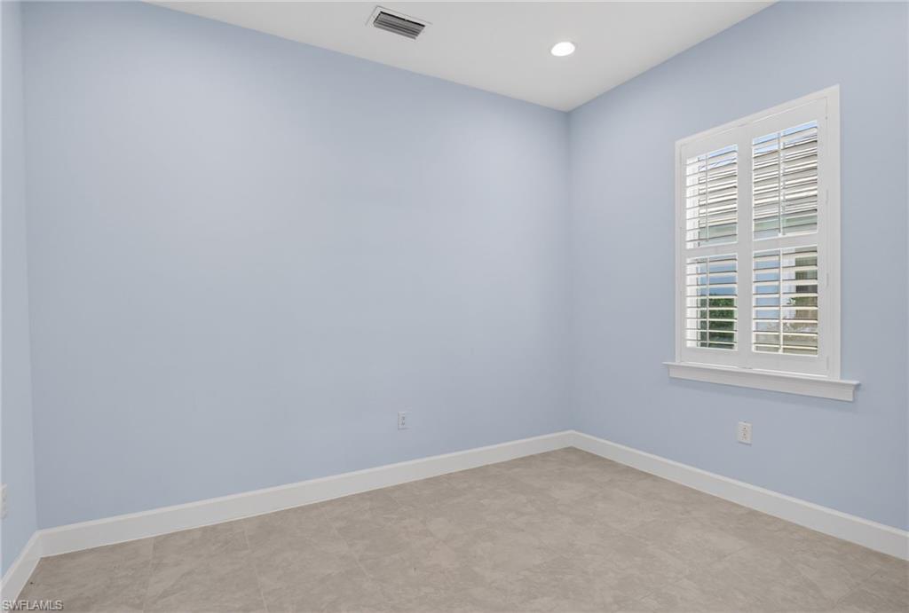 8813 Yucatan Court Naples, FL 34113 - Photo 27 of 43 Bedroom with baseboards and recessed lighting
