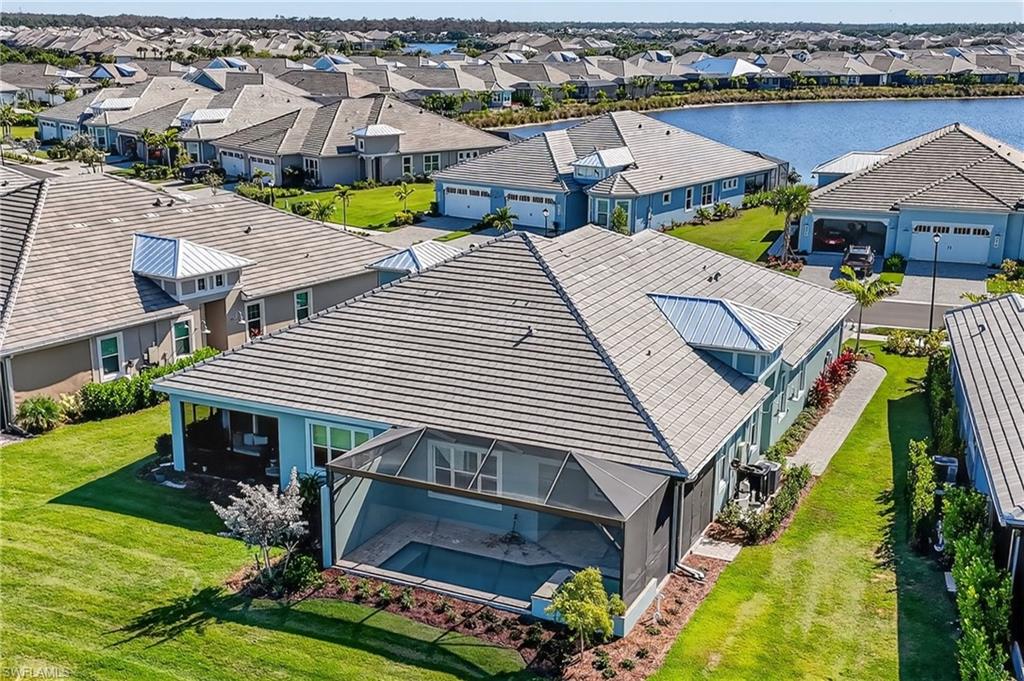8813 Yucatan Court Naples, FL 34113 - Photo 32 of 43 Aerial perspective of Home with a nearby body of water