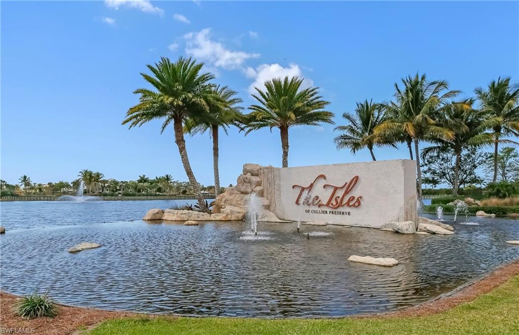 8813 Yucatan Court Naples, FL 34113 - Photo 35 of 43 Community sign with a water view