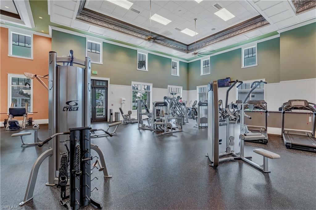 8813 Yucatan Court Naples, FL 34113 - Photo 42 of 43 Workout area featuring a towering ceiling and crown molding
