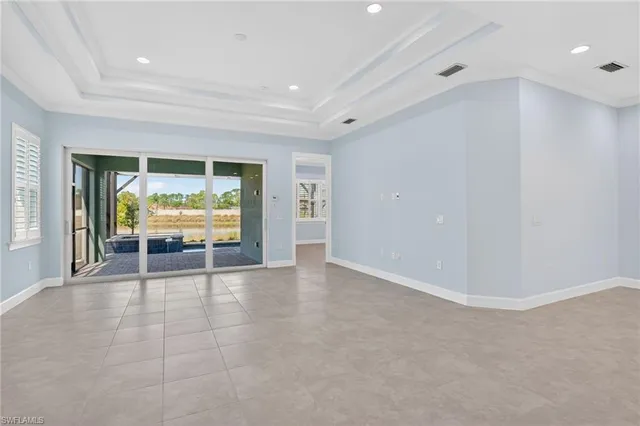 a view of an empty room with a fireplace