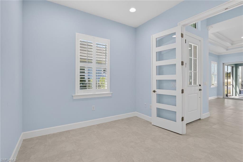 8813 Yucatan Court Naples, FL 34113 - Photo 8 of 43 Den with baseboards and recessed lighting
