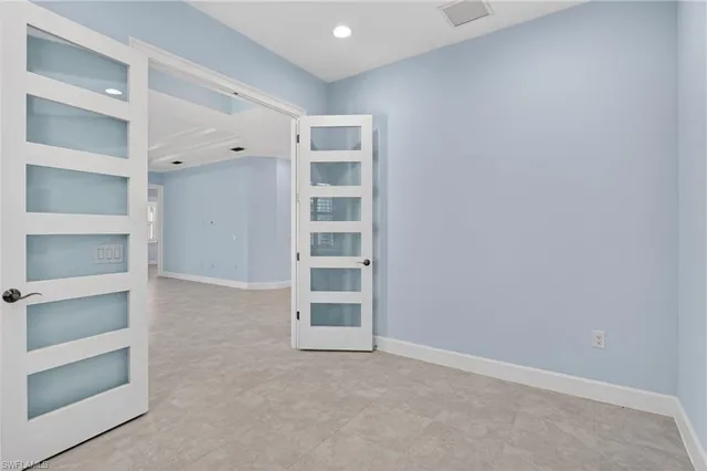 a view of an empty room with empty shelves