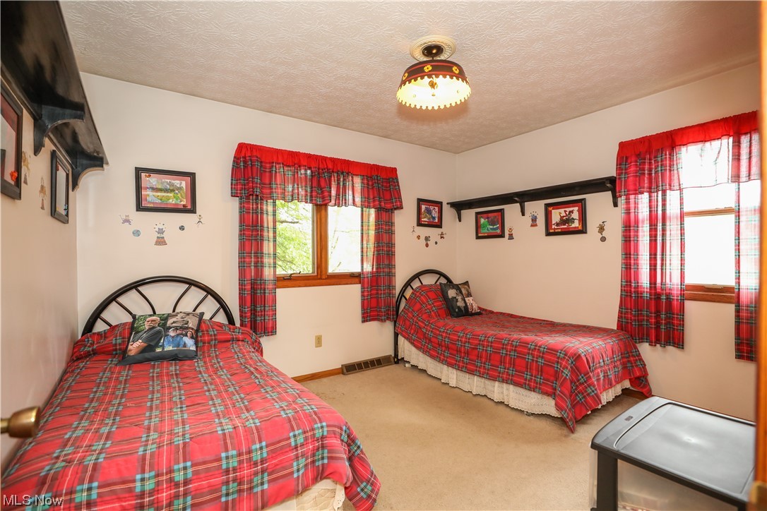 5344 Camp Road Ravenna, OH 44266 - Photo 16 of 30 Carpeted bedroom featuring a textured ceiling