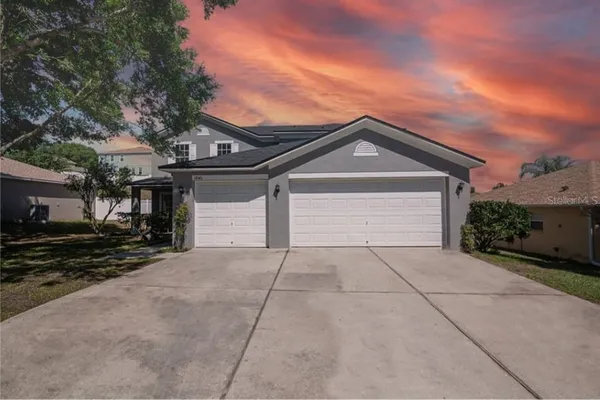 a kitchen with stainless steel appliances granite countertop a sink refrigerator and microwave