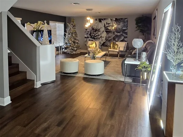 a room with kitchen island a wooden floor and a wooden floor