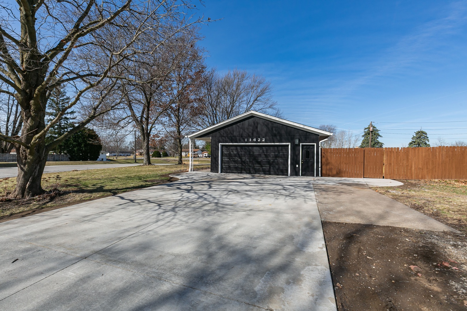 11622 27th Street West Milan, IL 61264 - Photo 43 of 49 a front view of a house with a yard and garage