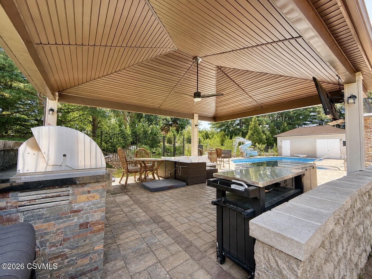 50 Sweet Gum Road Selinsgrove, PA 17870 - Photo 25 of 82 an outdoor sitting area with couch and umbrella