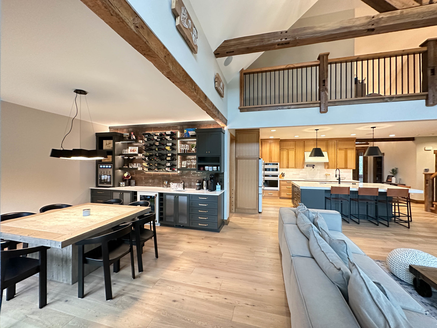 26005 Forrester Drive Plainfield, IL 60585 - Photo 6 of 19 a kitchen with stainless steel appliances kitchen island granite countertop a table chairs in it and wooden floor