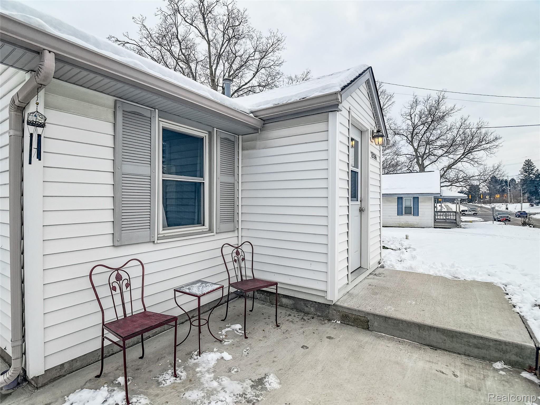 12034 North Seymour Road Montrose, MI 48457 - Photo 43 of 56 View of property exterior with a patio