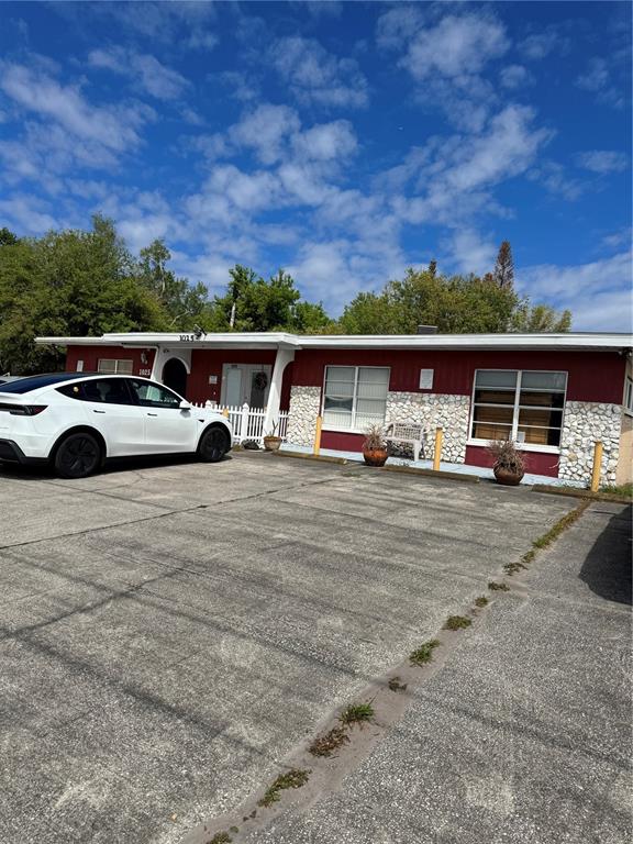 front view of a house with a car parked