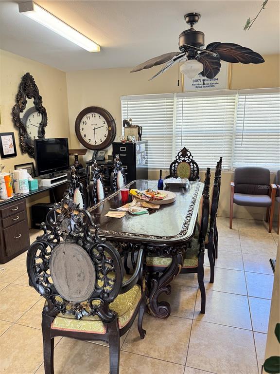 1025 West Oak Ridge Road Orlando, FL 32839 - Photo 2 of 4 a view of a dining room with furniture and chandelier