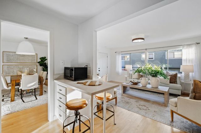 a view of a livingroom with furniture and a table