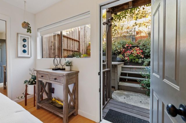 a view of living room with furniture and a floor to ceiling window