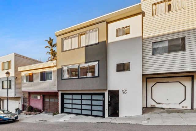 a view of a house with large windows