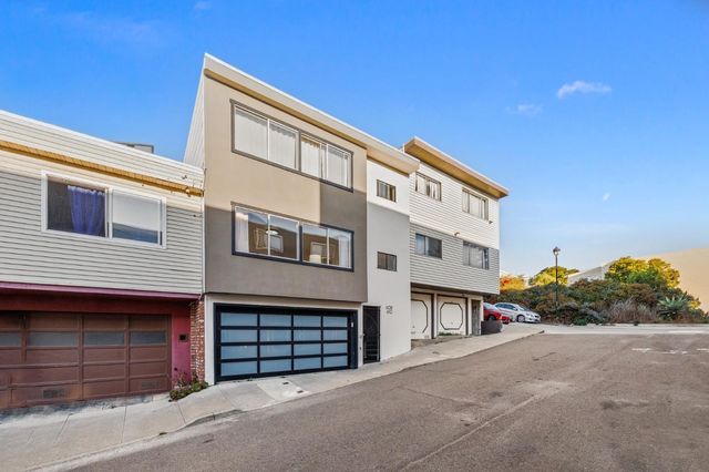 a front view of a house with a garage