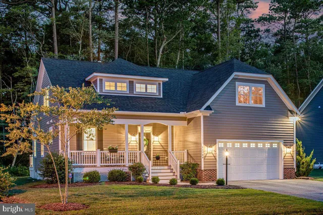 an aerial view of a house with outdoor space swimming pool and tennis court