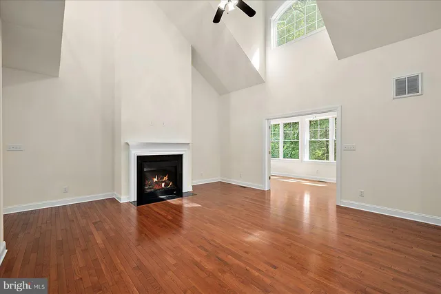 a kitchen with kitchen island granite countertop stainless steel appliances cabinets a sink and a counter top space