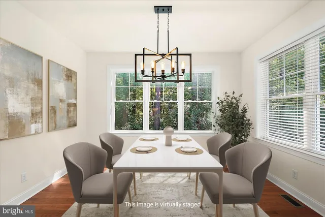 a view of empty room with floor to ceiling window and ceiling fan