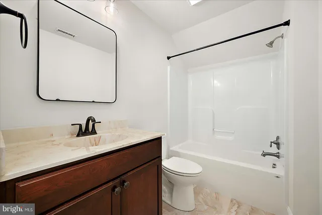 an aerial view of a house with a yard swimming pool and outdoor seating