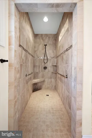 a view of a house with pool and chairs