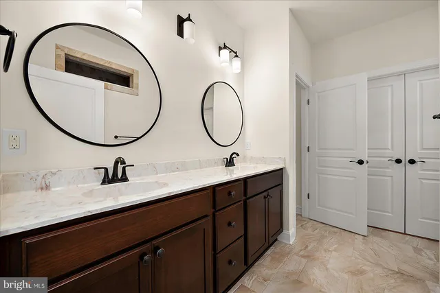 a house with lots of trees in the background