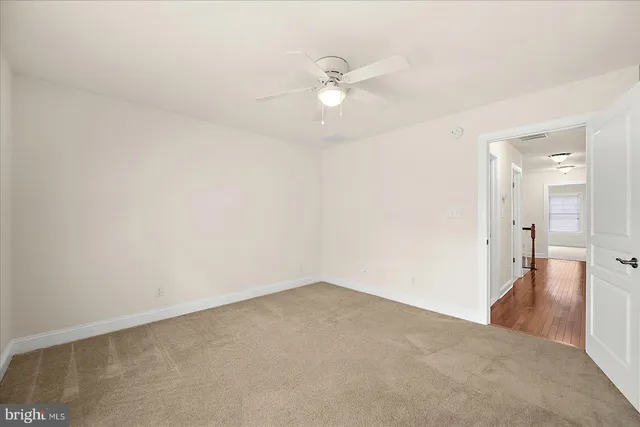 a view of a patio with couches table and chairs and potted plants
