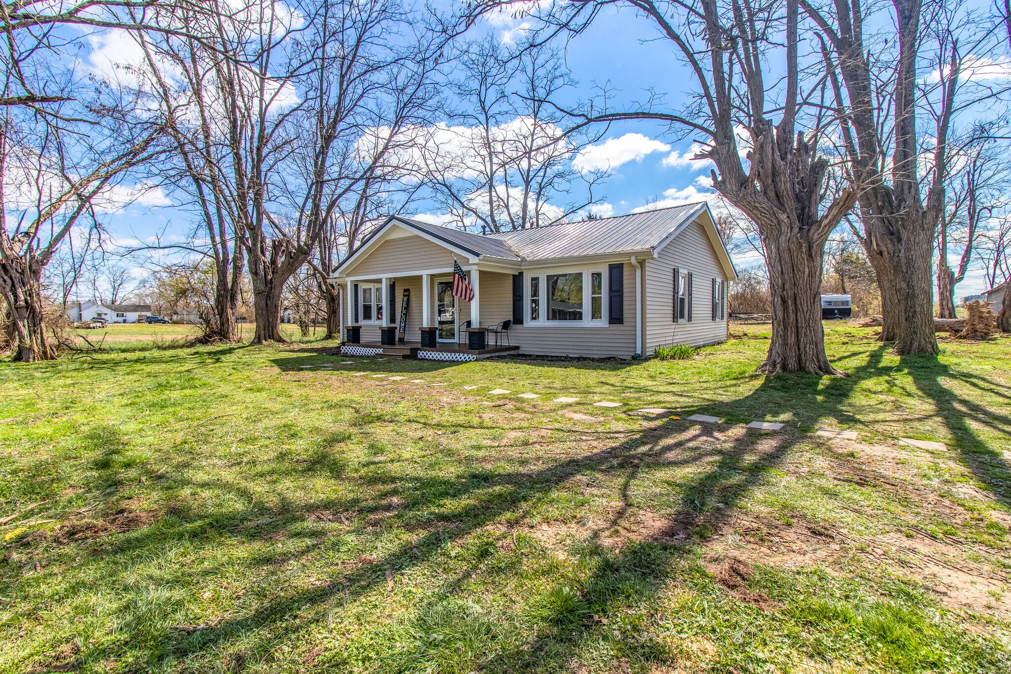 810 Days Road Lafayette, TN 37083 - Photo 3 of 20 a front view of a house with a yard and large trees
