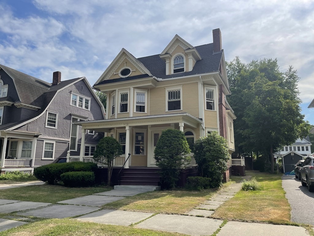 86 Magnolia Terrace Springfield, MA 01108 - Photo 2 of 32 a front view of a house with a yard