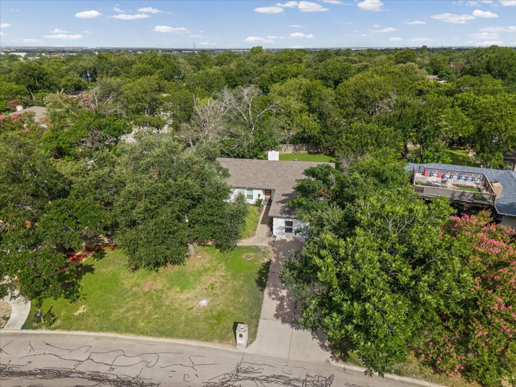 1406 North Georgetown Street Round Rock, TX 78664 - Photo 28 of 34 Mature trees and lush landscaping surround this inviting residential property.