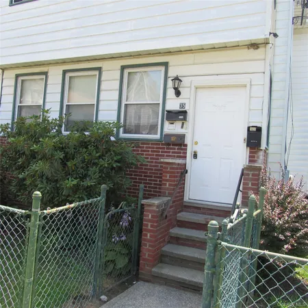 a view of front door and small yard